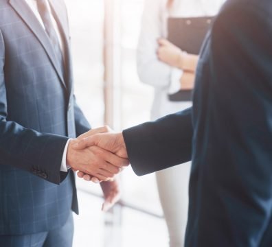 Business people shaking hands, finishing up a meeting