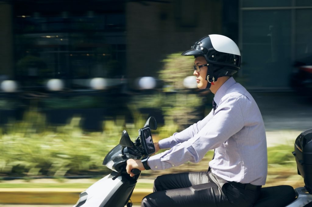 Chinese Businessman Commuter Riding Scooter Motorcycle In City